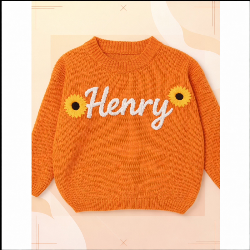 Oranger Babypullover mit dem Namen Henry und Sonnenblumen