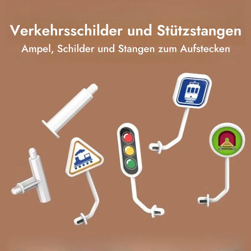 Kind baut eine neue Strecke aus den Bausteinen