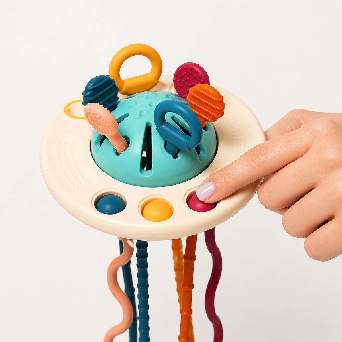 Die Klickknöpfe und Zugbänder des Silikon-Babyspielzeugs