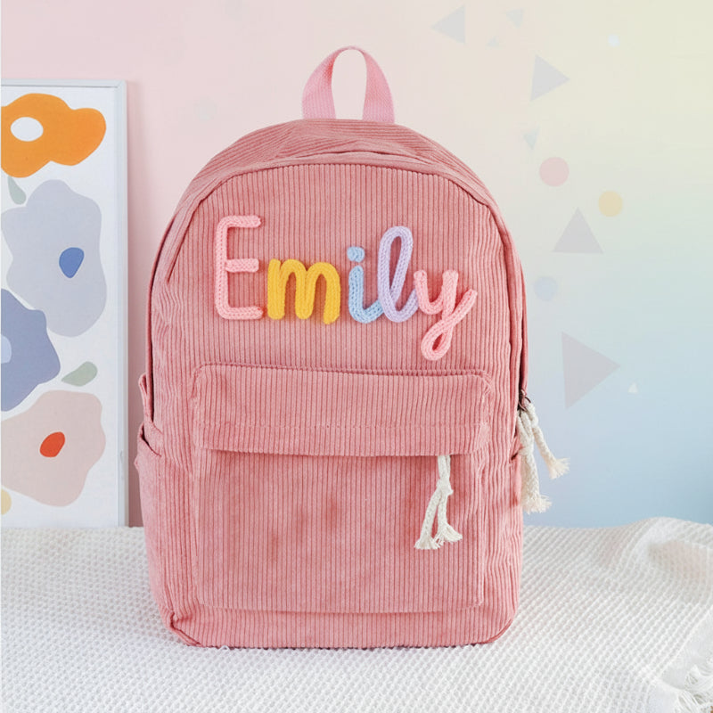 Rosa Cord-Rucksack mit gesticktem Namen