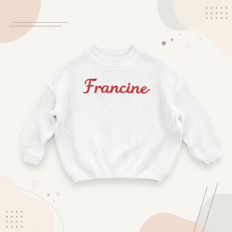 Weißer Pullover mit dem Namen Francine in roten Buchstaben
